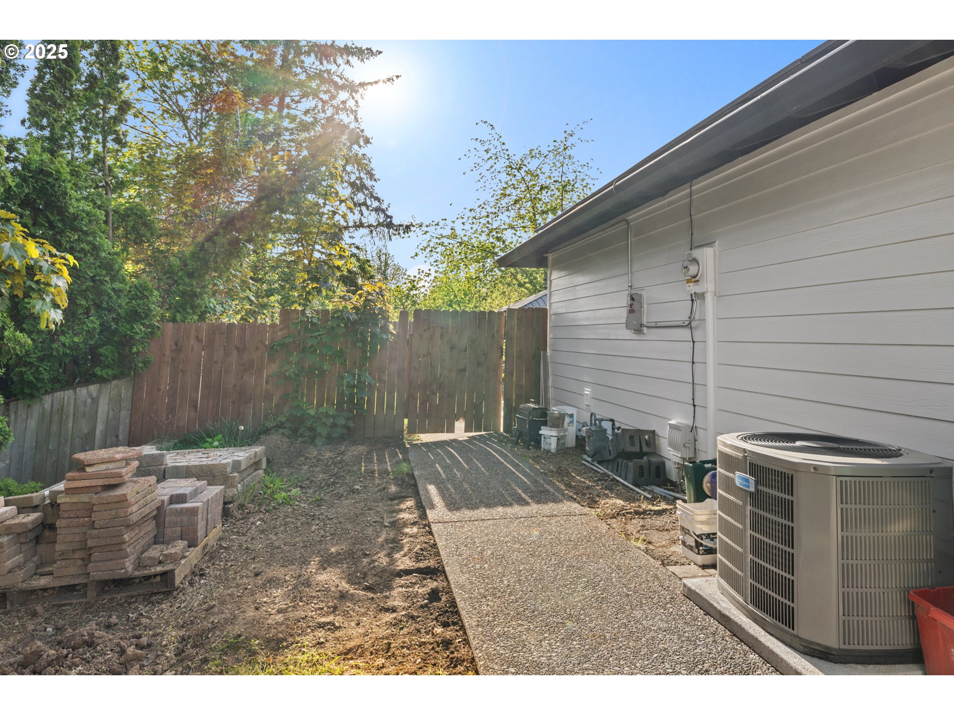 14435 Southwest Yearling Way Beaverton, OR 97008 - Photo 42 of 47 a backyard of a house with table and chairs