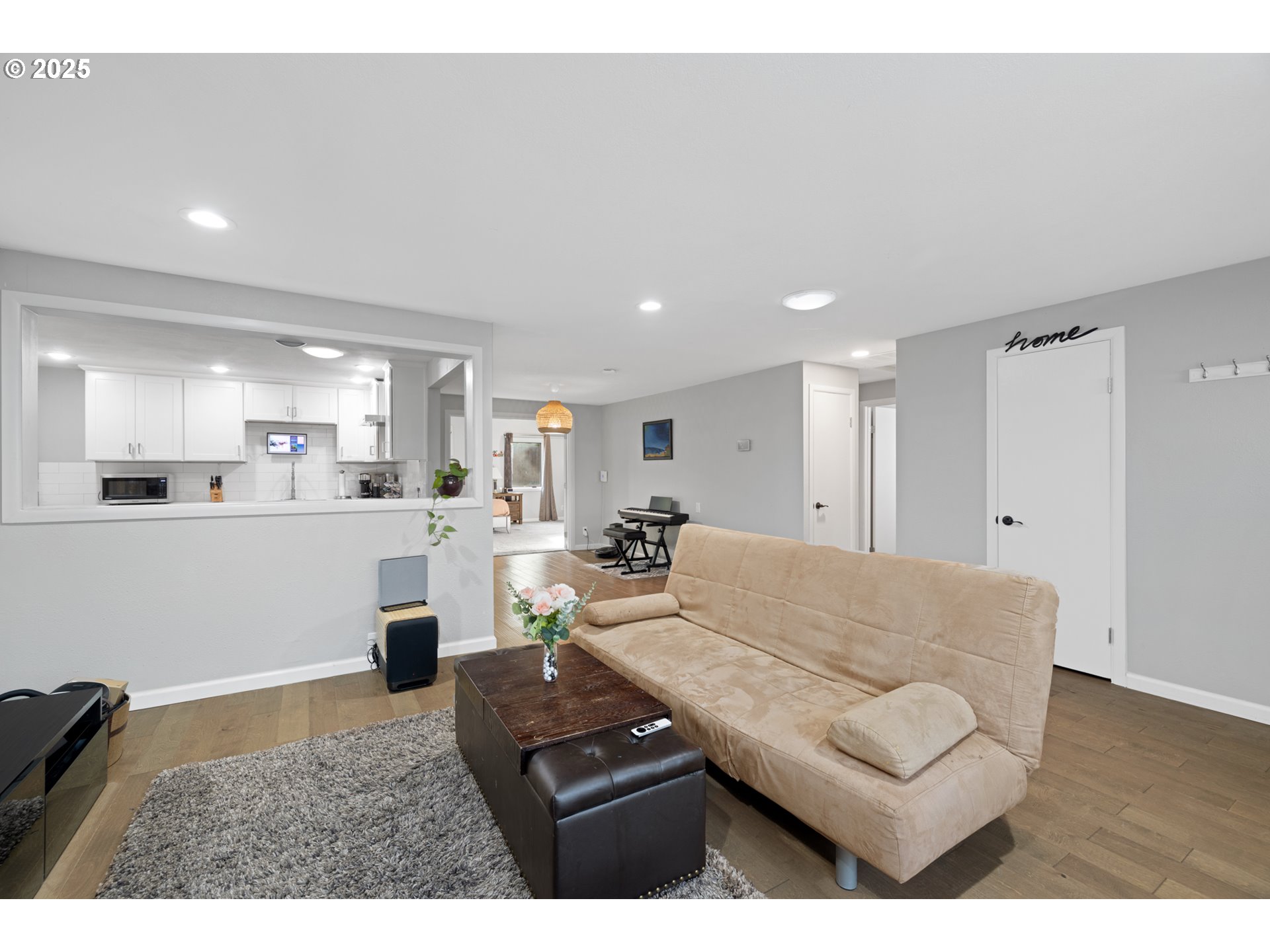 14435 Southwest Yearling Way Beaverton, OR 97008 - Photo 9 of 47 a living room with furniture and a wooden floor