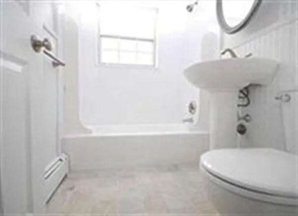 a bathroom with a sink a toilet and a bathtub