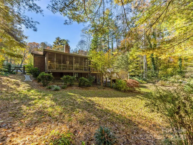 a balcony with furniture and a potted plant