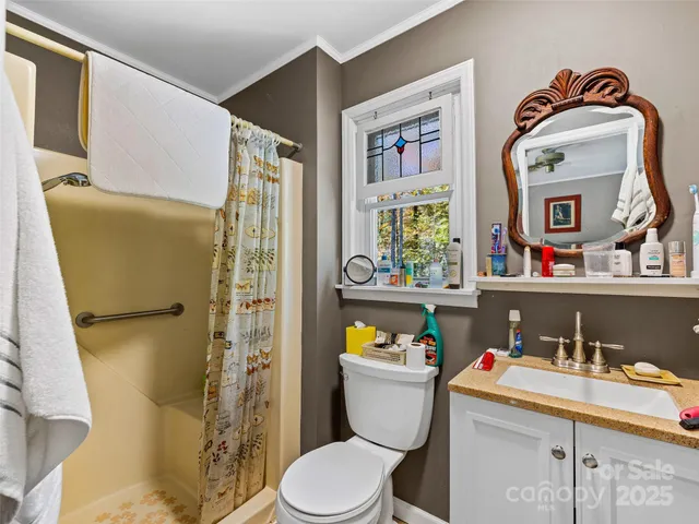 a bedroom with furniture and a rug