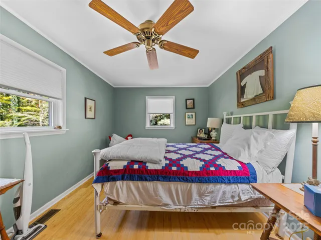 a living room with furniture a rug and a chandelier