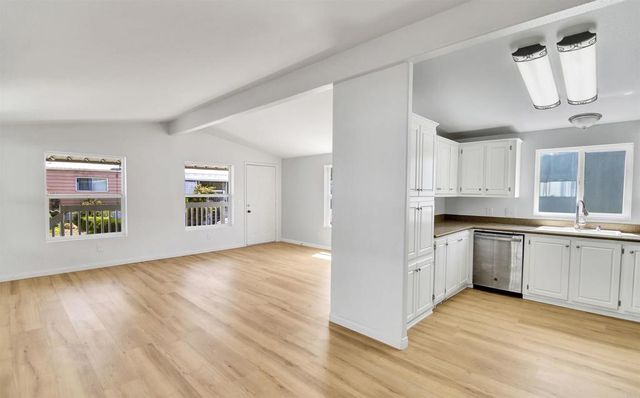 a view of a kitchen with electric appliances