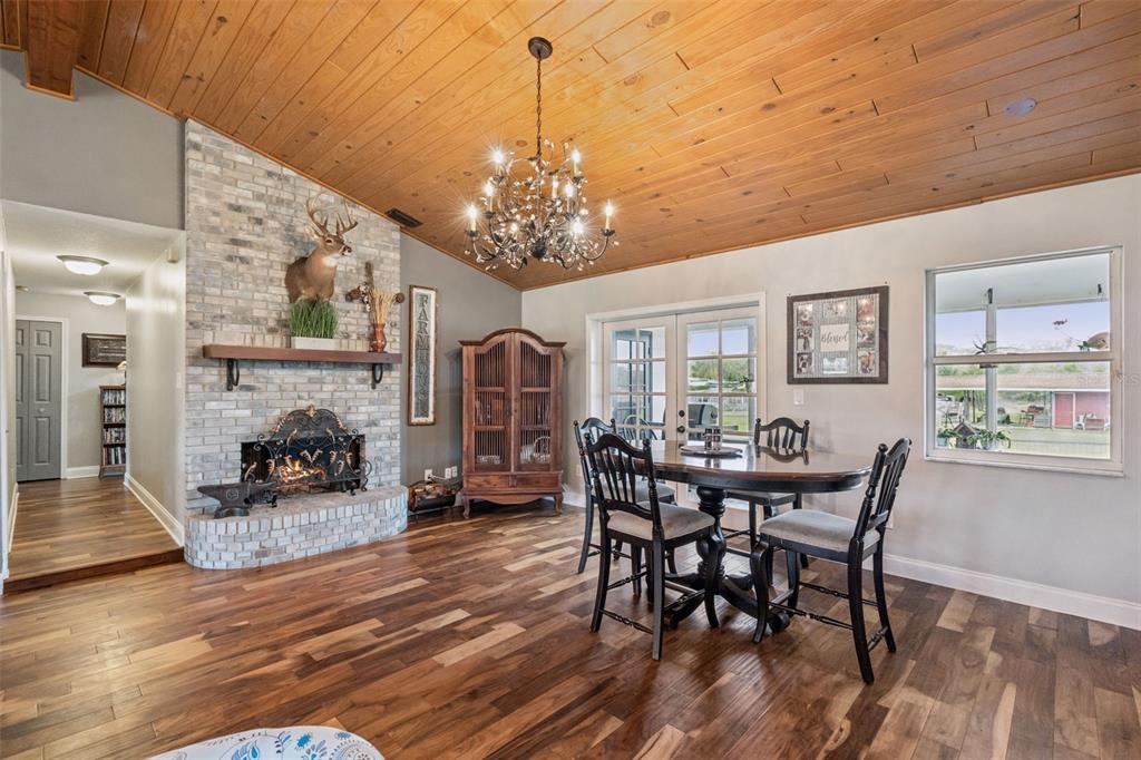 1330 Lake Mills Road Chuluota, FL 32766 - Photo 11 of 59 a view of a dining room with furniture window and wooden floor