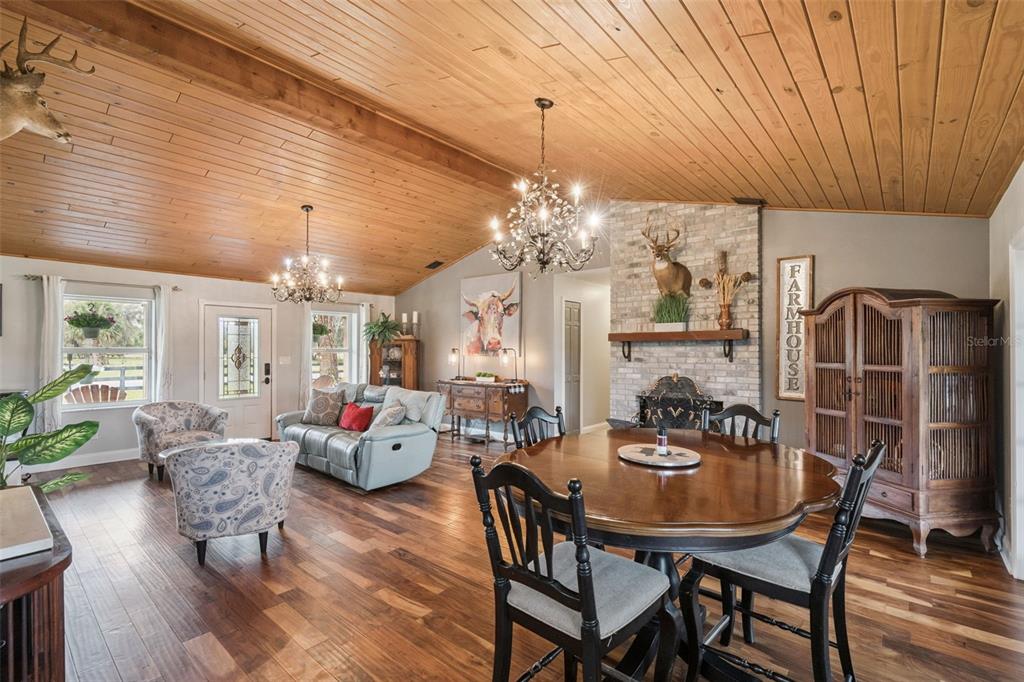 1330 Lake Mills Road Chuluota, FL 32766 - Photo 13 of 59 a view of a dining room with furniture window and wooden floor
