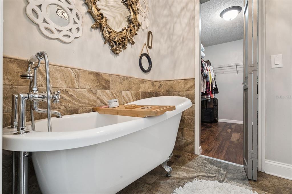 1330 Lake Mills Road Chuluota, FL 32766 - Photo 26 of 59 a bathroom with a bathtub and a sink
