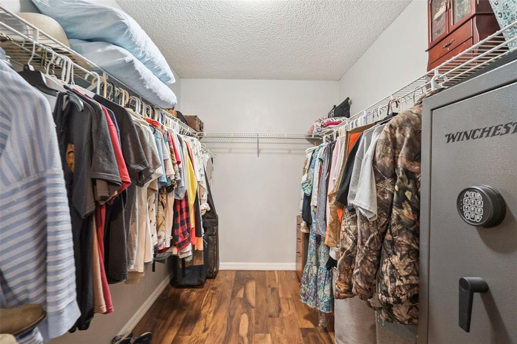 1330 Lake Mills Road Chuluota, FL 32766 - Photo 28 of 59 a view of walk in closet with clothes and shoes