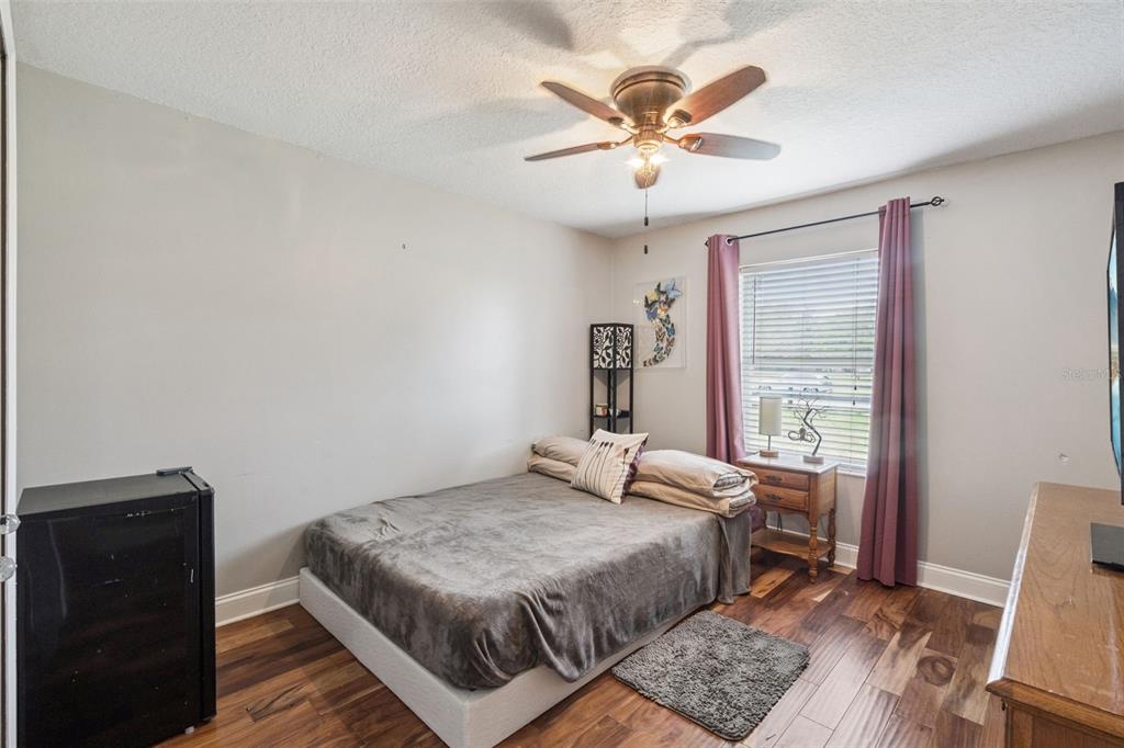 1330 Lake Mills Road Chuluota, FL 32766 - Photo 29 of 59 a bedroom with a bed and a window