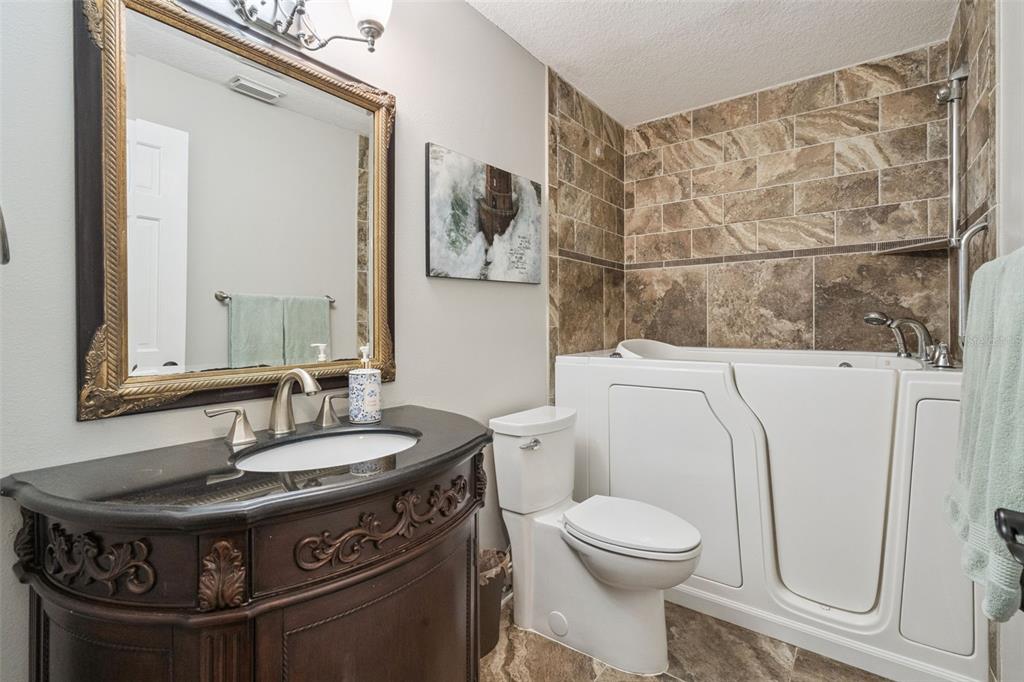 1330 Lake Mills Road Chuluota, FL 32766 - Photo 33 of 59 a bathroom with a sink a toilet and a mirror