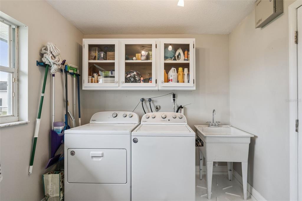 1330 Lake Mills Road Chuluota, FL 32766 - Photo 34 of 59 a utility room with dryer and washer