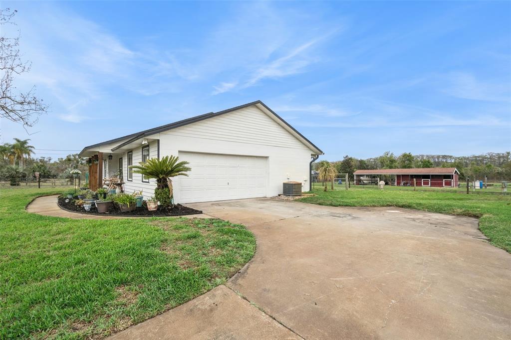1330 Lake Mills Road Chuluota, FL 32766 - Photo 39 of 59 a front view of house with yard and green space