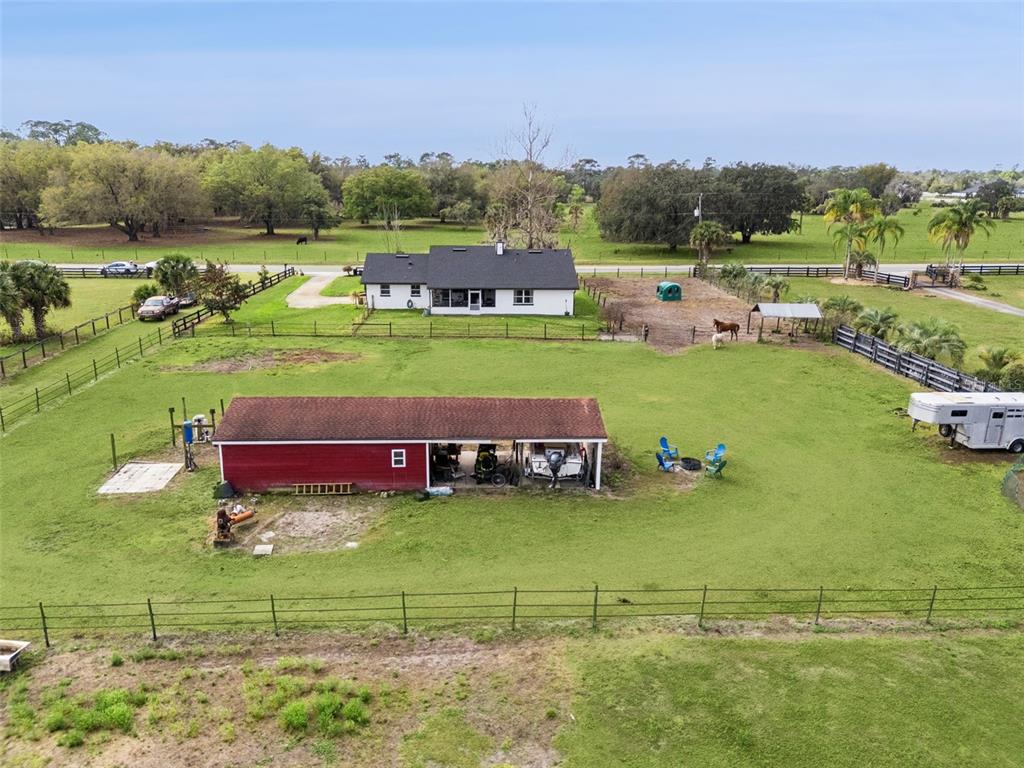 1330 Lake Mills Road Chuluota, FL 32766 - Photo 44 of 59 a view of a lake with houses yard and outdoor view