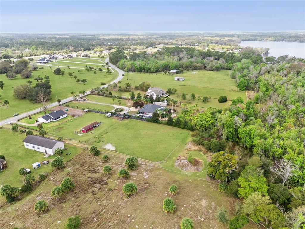 1330 Lake Mills Road Chuluota, FL 32766 - Photo 46 of 59 a view of a lake with a city