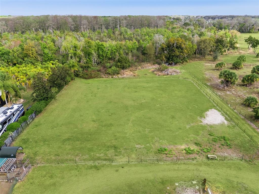 1330 Lake Mills Road Chuluota, FL 32766 - Photo 55 of 59 a view of a yard with an outdoor space