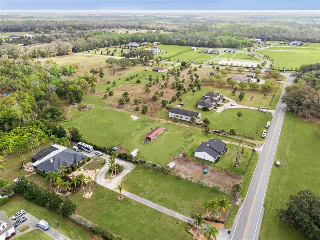 1330 Lake Mills Road Chuluota, FL 32766 - Photo 57 of 59 an aerial view of residential houses with outdoor space