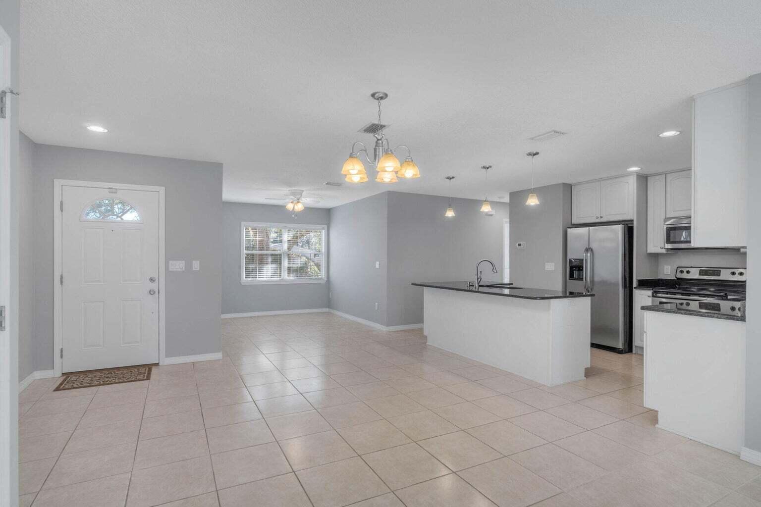 75 7th Avenue Shalimar, FL 32579 - Photo 11 of 42 a view of a kitchen with a sink and refrigerator