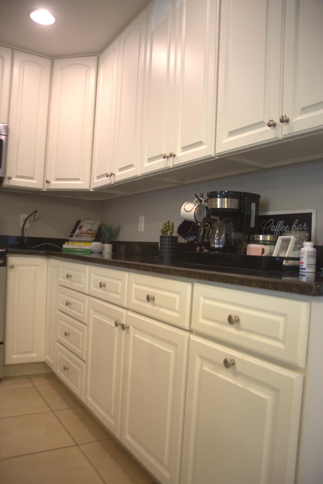 75 7th Avenue Shalimar, FL 32579 - Photo 13 of 42 a kitchen with granite countertop white cabinets and a sink