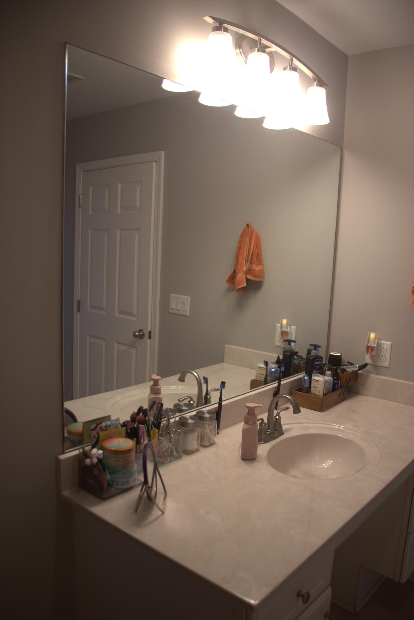 75 7th Avenue Shalimar, FL 32579 - Photo 26 of 42 a bathroom with a sink and a mirror