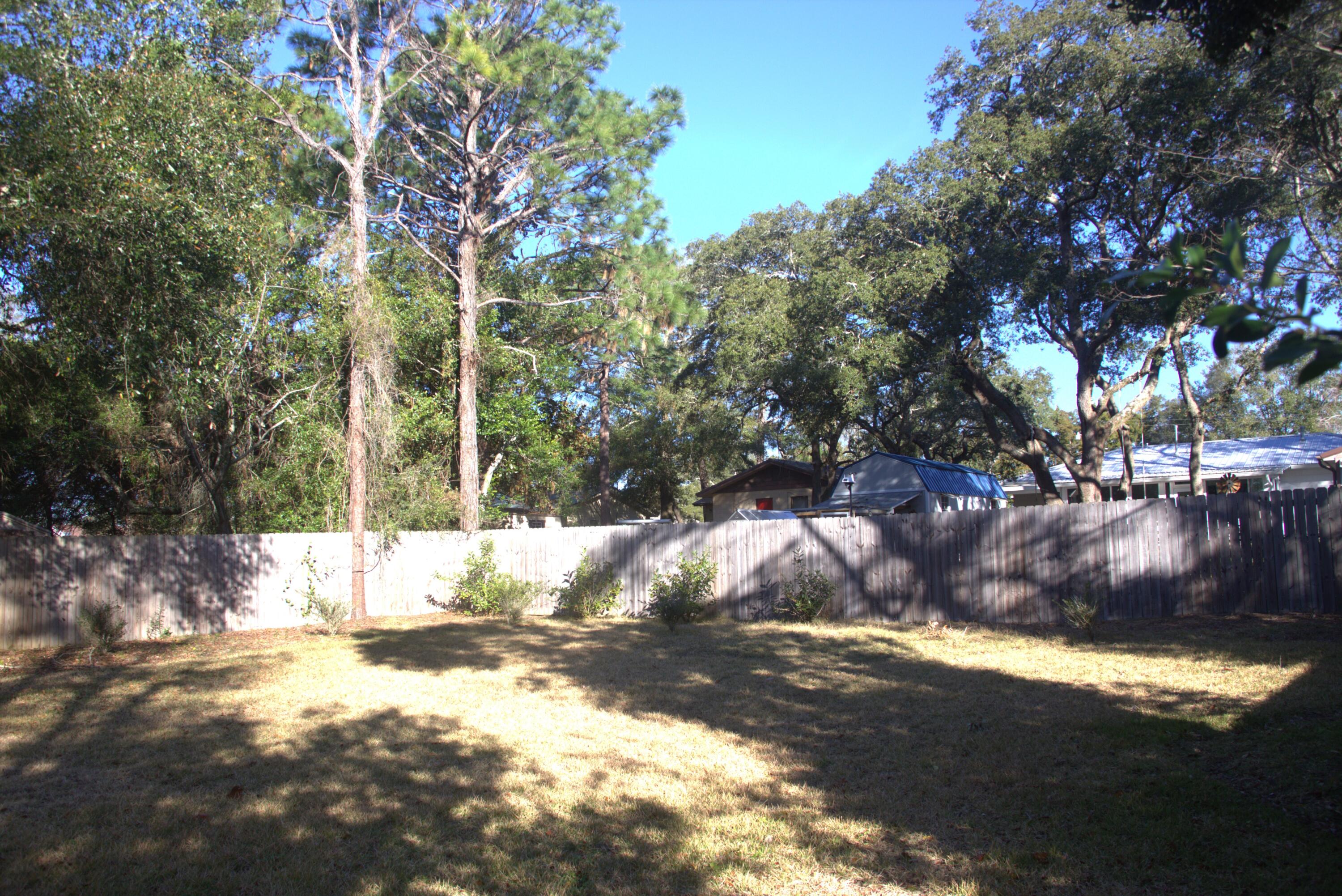 75 7th Avenue Shalimar, FL 32579 - Photo 29 of 42 a view of a yard with large trees