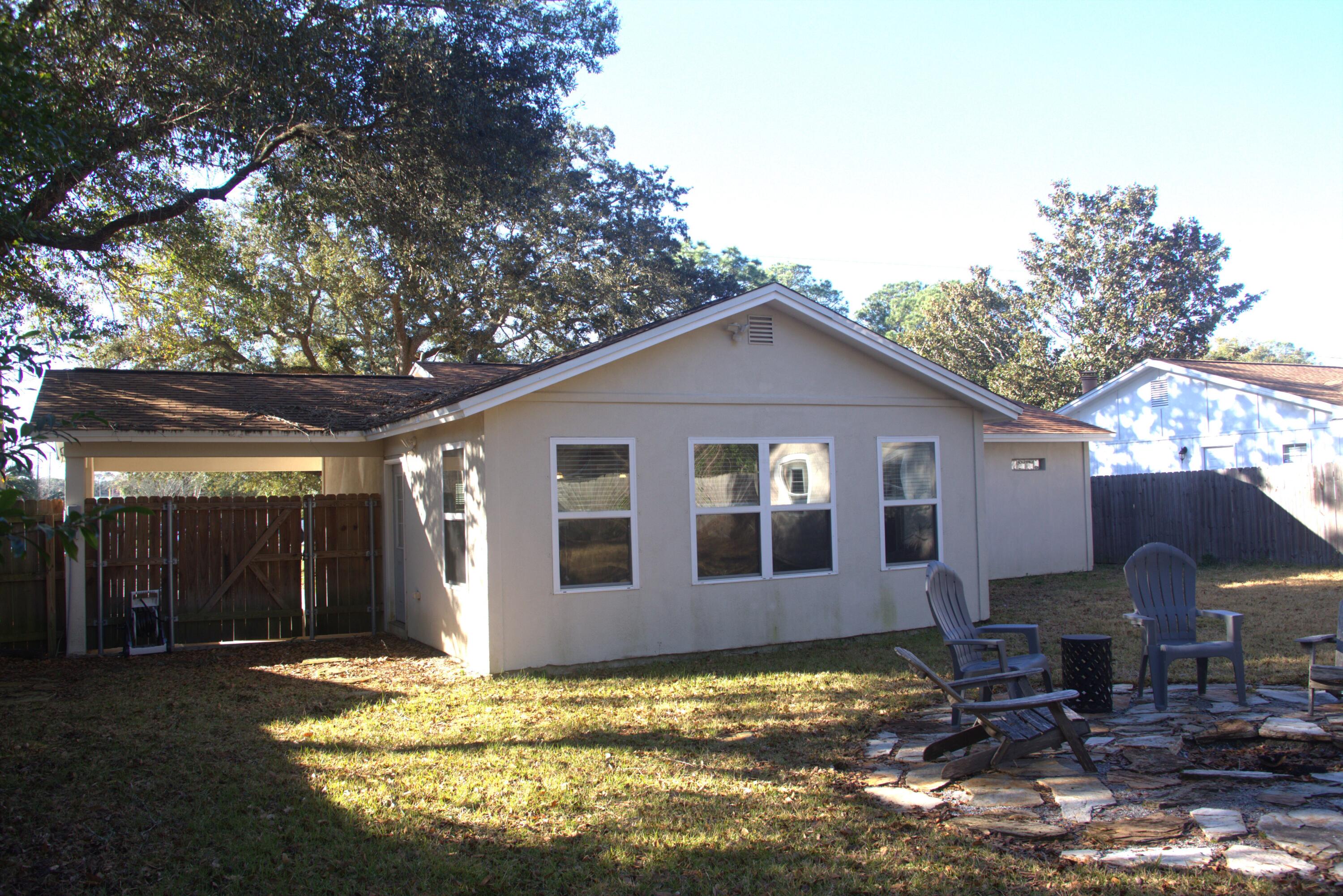 75 7th Avenue Shalimar, FL 32579 - Photo 30 of 42 a view of a house with backyard and sitting area