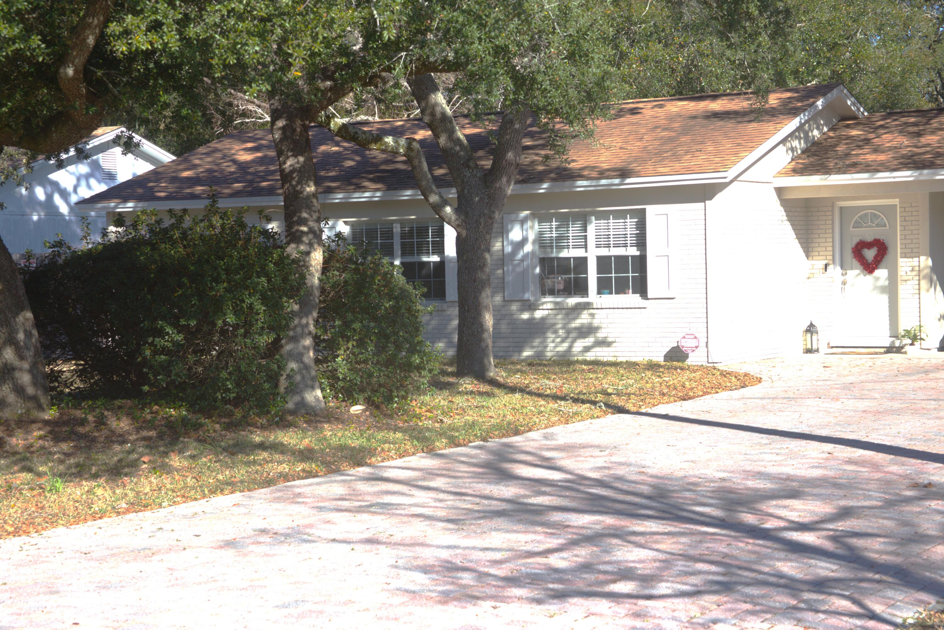 75 7th Avenue Shalimar, FL 32579 - Photo 3 of 42 a view of a house with snow on the road