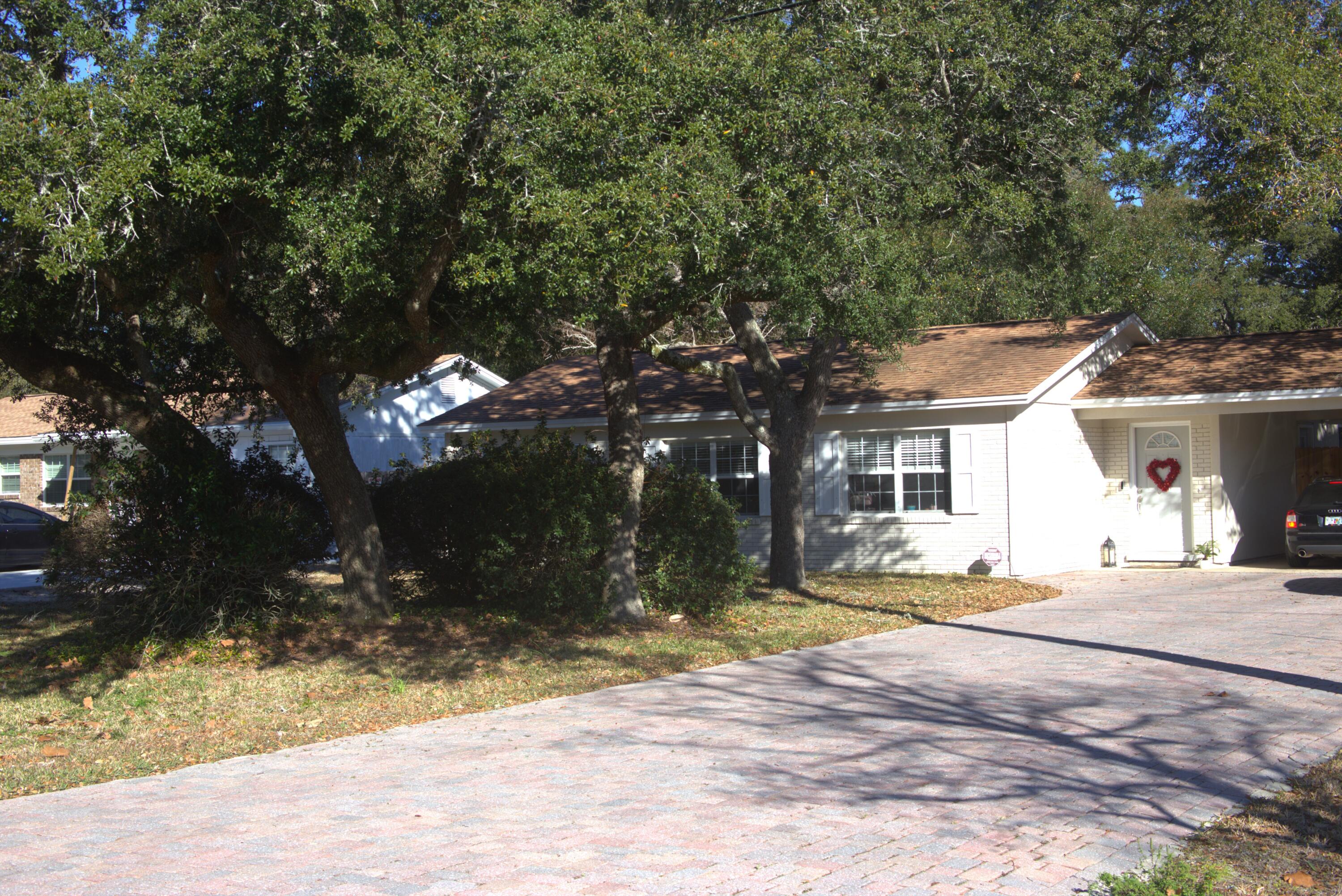 75 7th Avenue Shalimar, FL 32579 - Photo 32 of 42 a view of a house with snow on the tree