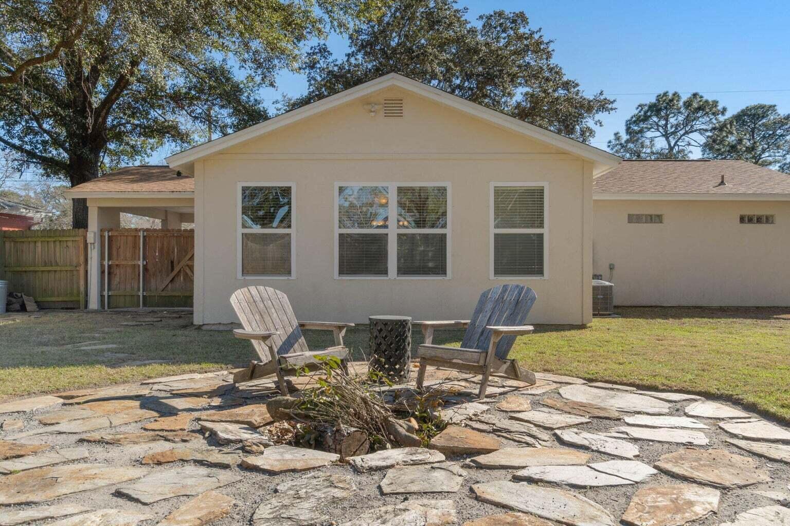 75 7th Avenue Shalimar, FL 32579 - Photo 38 of 42 a front view of house with yard outdoor seating and barbeque oven