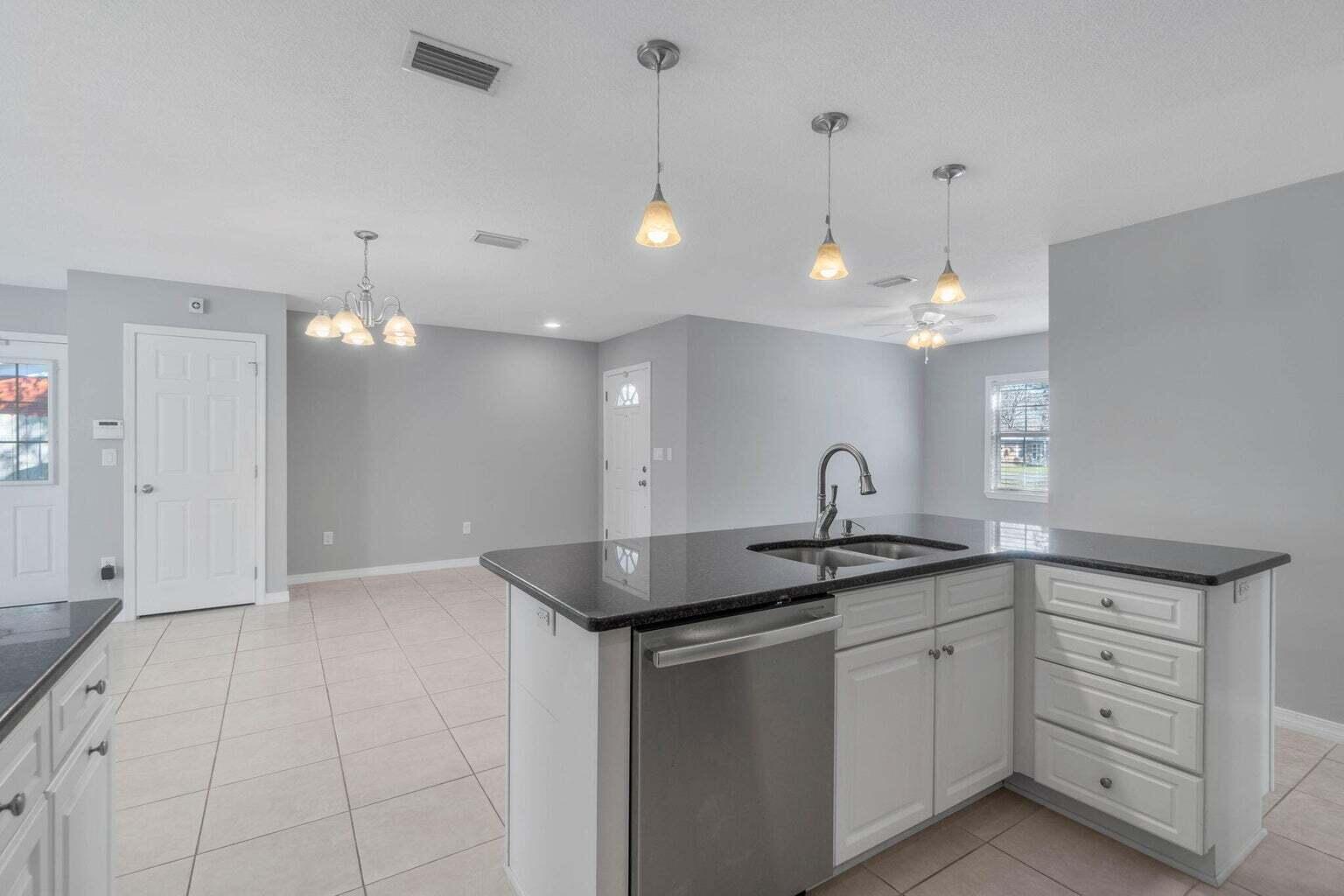 75 7th Avenue Shalimar, FL 32579 - Photo 10 of 42 a kitchen with a sink and white cabinets