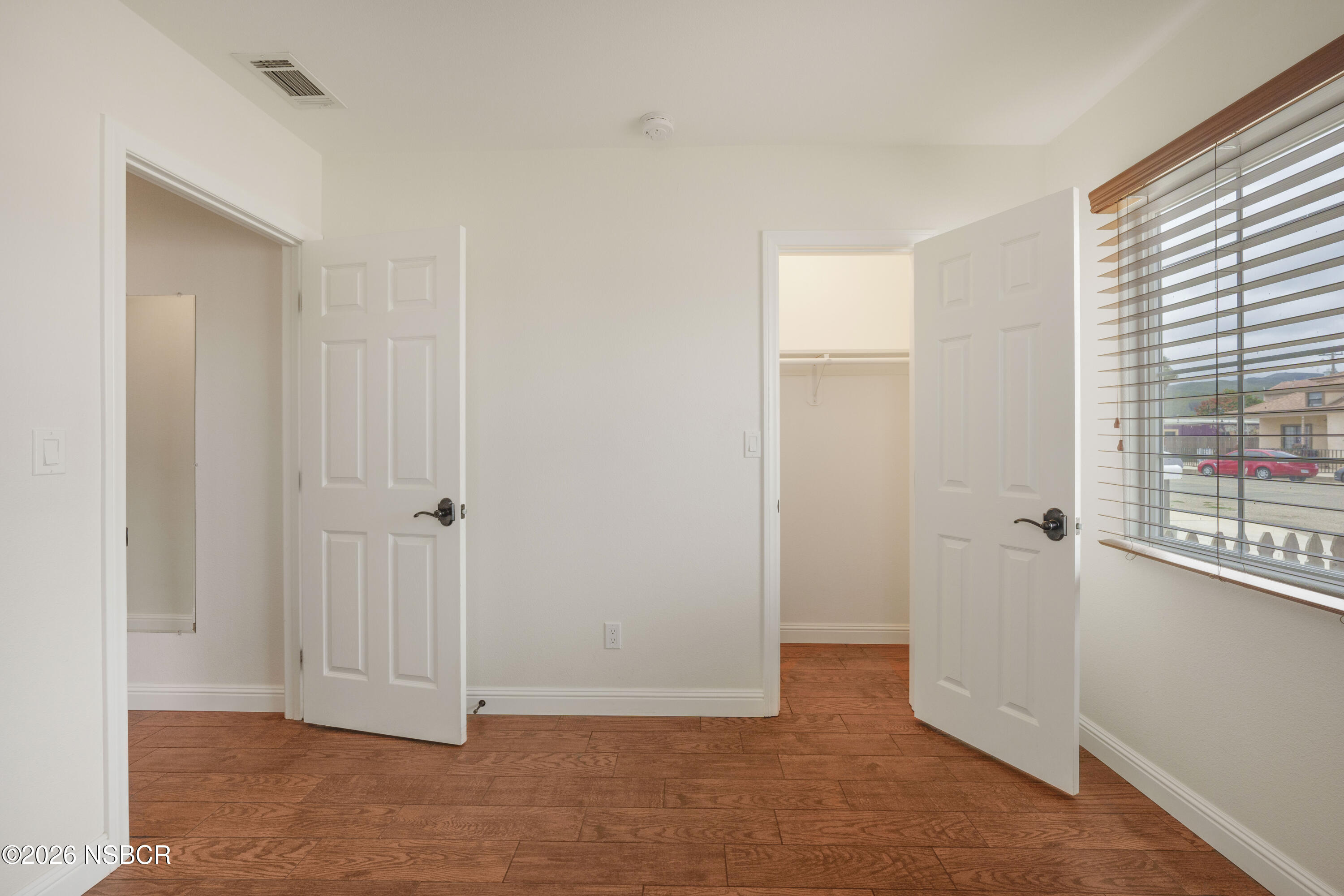138 North E Street Lompoc, CA 93436 - Photo 20 of 35 a view of entryway with wooden floor
