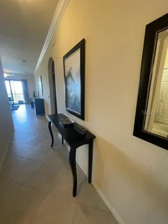a room with lots of frames and glass door