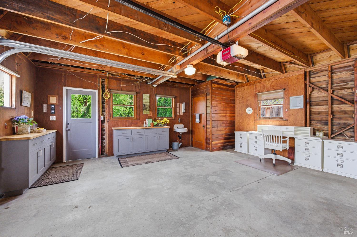 1829 3rd Street Napa, CA 94559 - Photo 36 of 51 Four car garage with cabinets and half bath