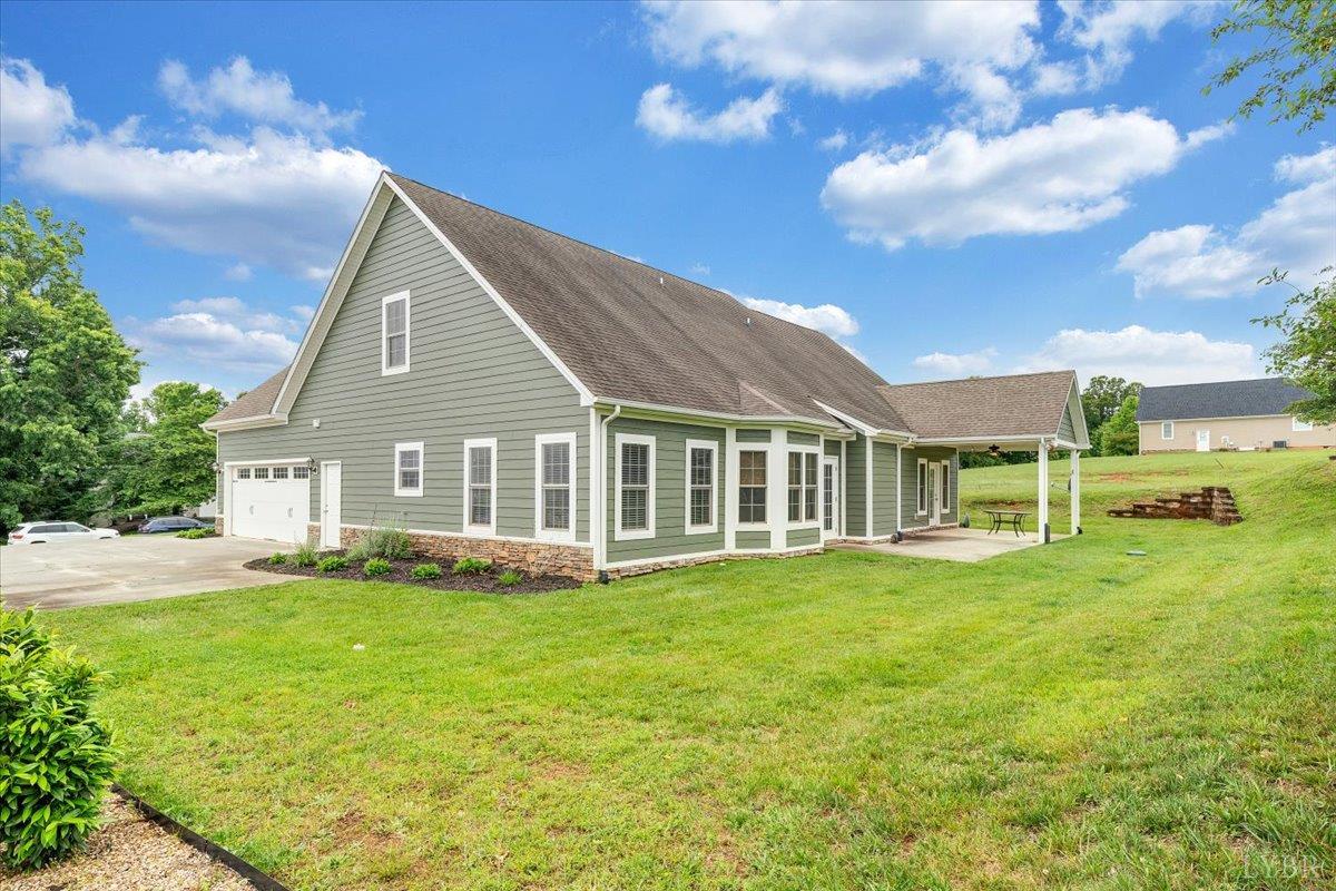 1250 Our Cove Road Huddleston, VA 24104 - Photo 48 of 70 a front view of a house with a garden