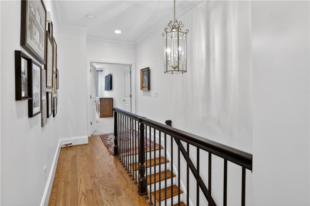 3552 Roswell Road Northwest Atlanta, GA 30305 - Photo 14 of 32 a view of a hallway with wooden floor and staircase
