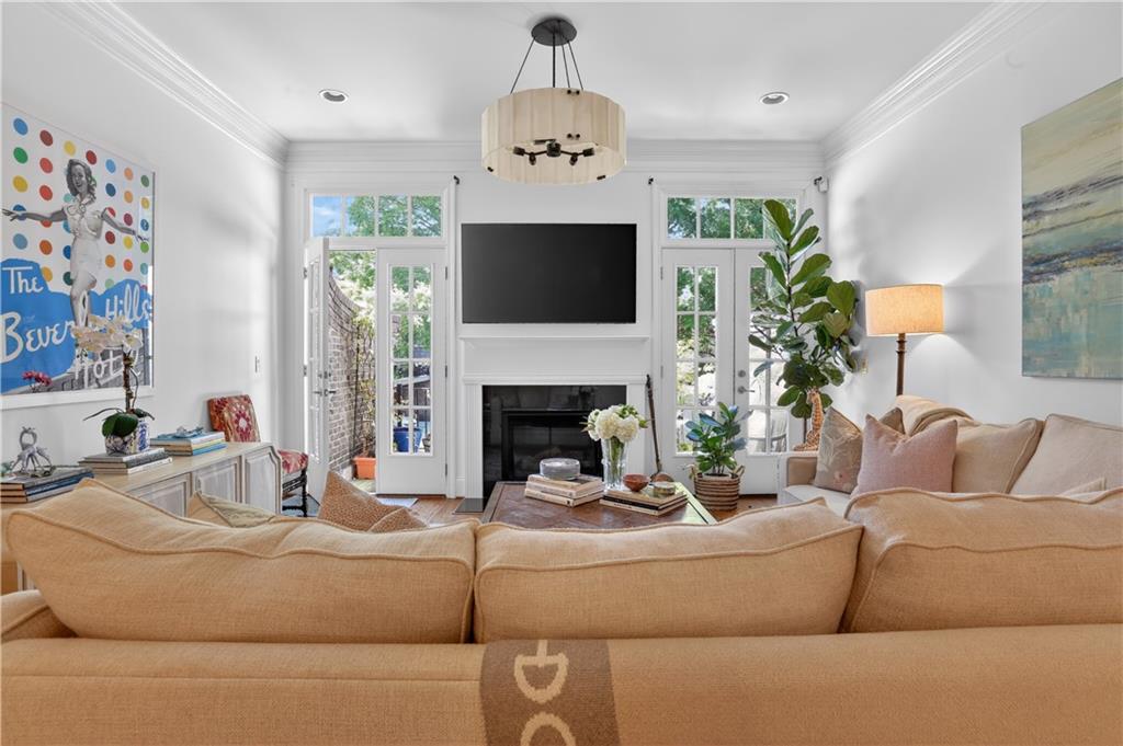 3552 Roswell Road Northwest Atlanta, GA 30305 - Photo 2 of 32 a living room with furniture and a fireplace