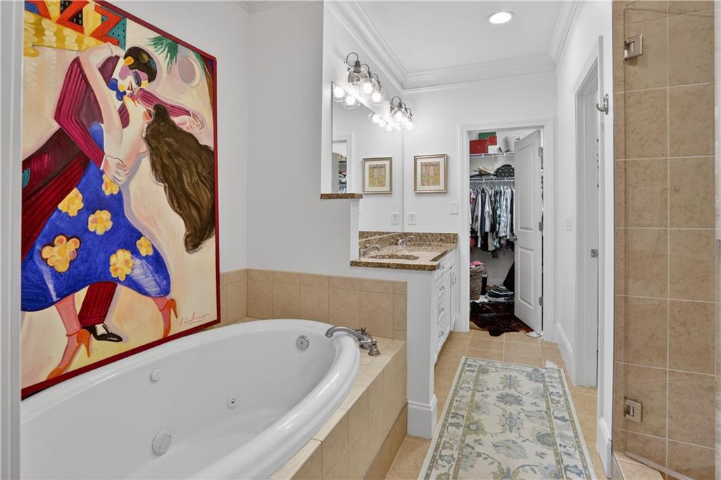 3552 Roswell Road Northwest Atlanta, GA 30305 - Photo 21 of 32 a bathroom with a bathtub and a shower