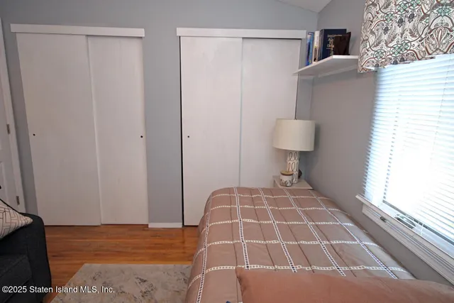 a bedroom with a bed and a toilet