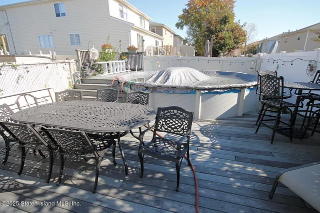 a view of a dinning table and chairs in patio