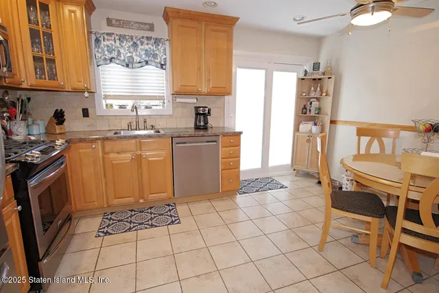 a kitchen with a stove a sink and a refrigerator