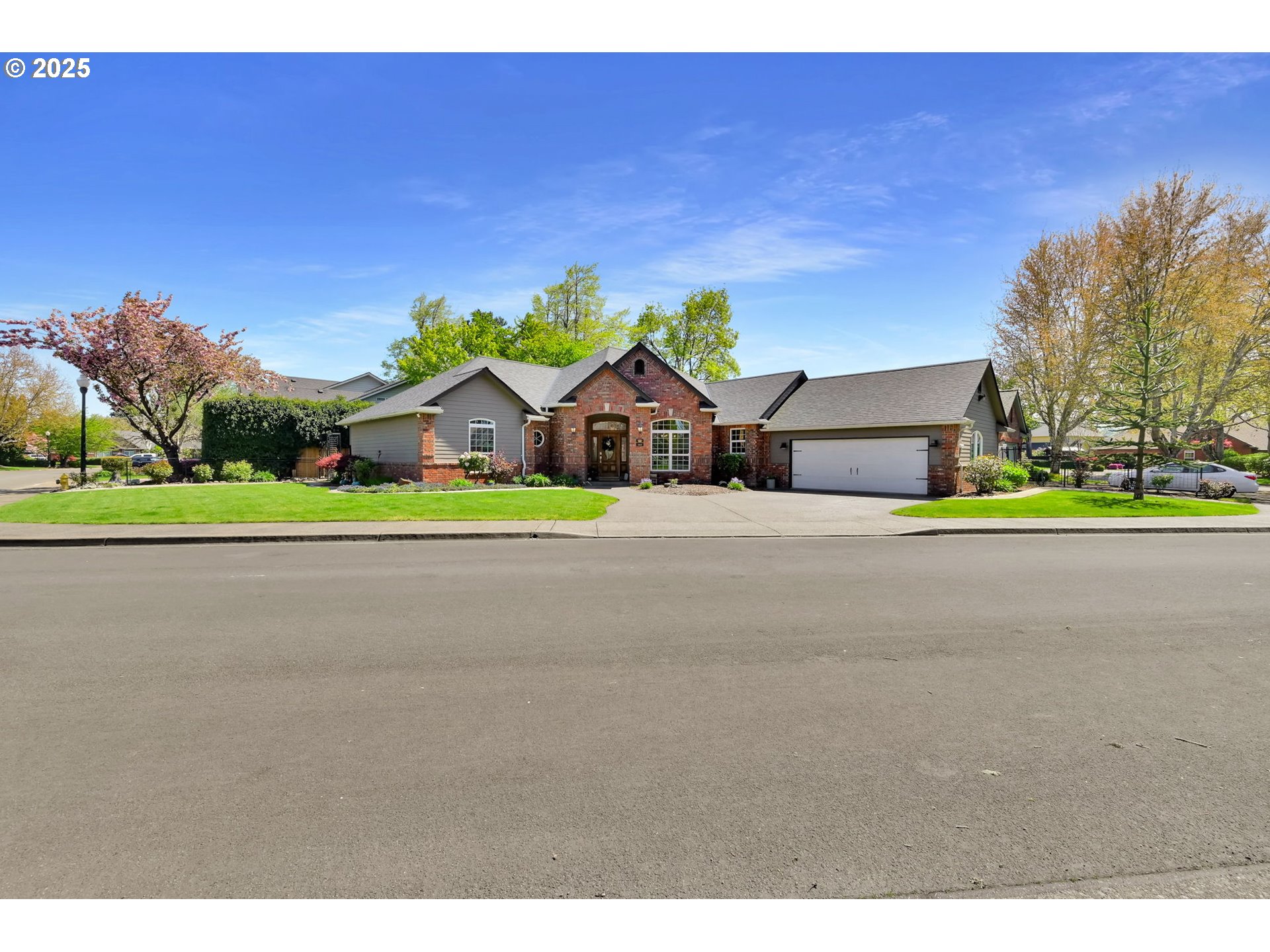 1417 Wimbledon Place Springfield, OR 97477 - Photo 2 of 48 a house with a yard and a car park