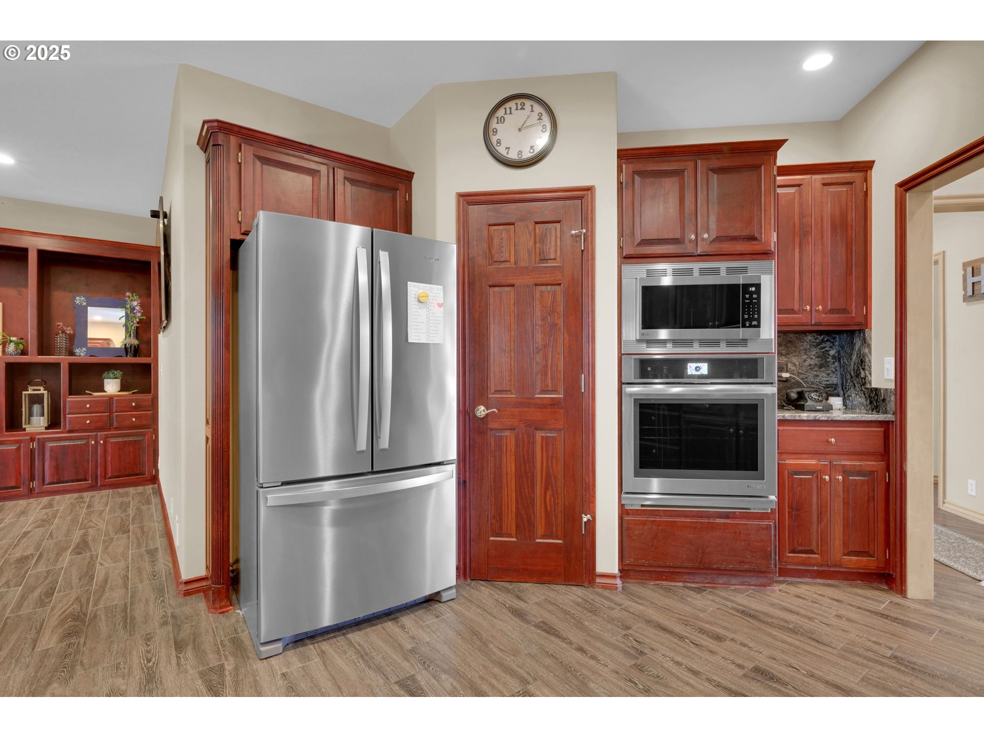 1417 Wimbledon Place Springfield, OR 97477 - Photo 21 of 48 a kitchen with stainless steel appliances granite countertop a refrigerator and a stove top oven