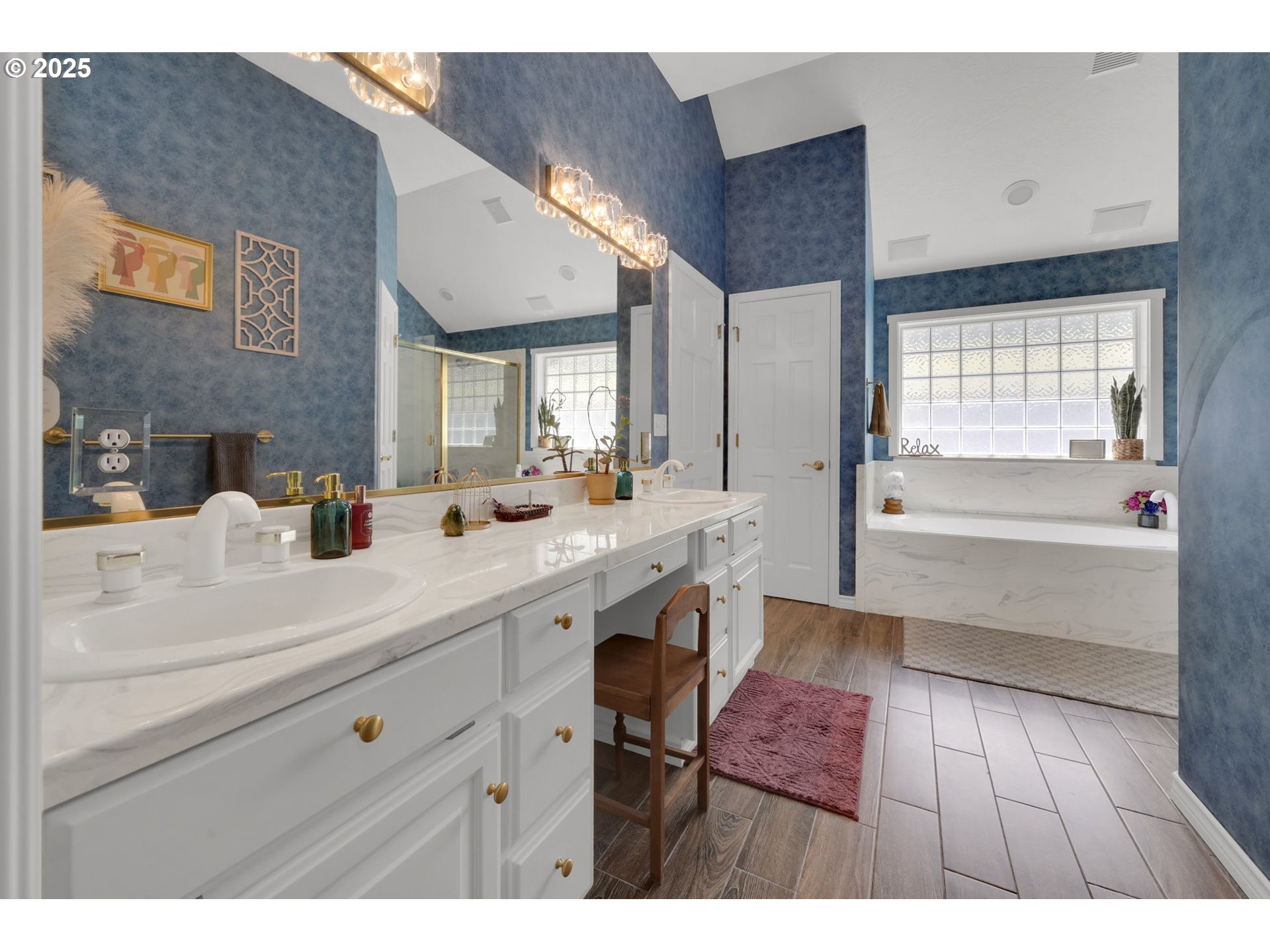 1417 Wimbledon Place Springfield, OR 97477 - Photo 39 of 48 a spacious bathroom with a double vanity sink a mirror and a bathtub