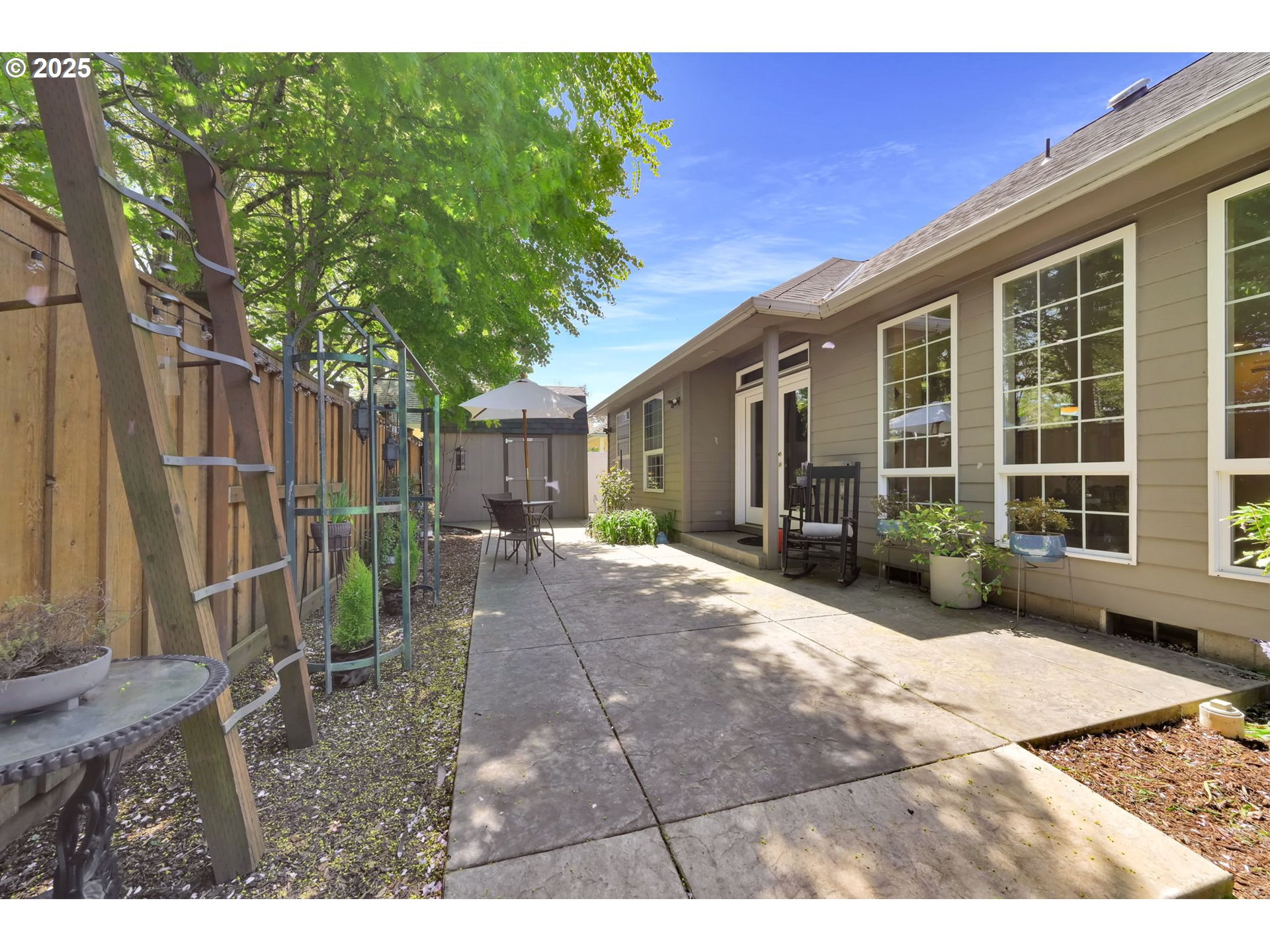 1417 Wimbledon Place Springfield, OR 97477 - Photo 45 of 48 a view of a house with backyard and sitting area