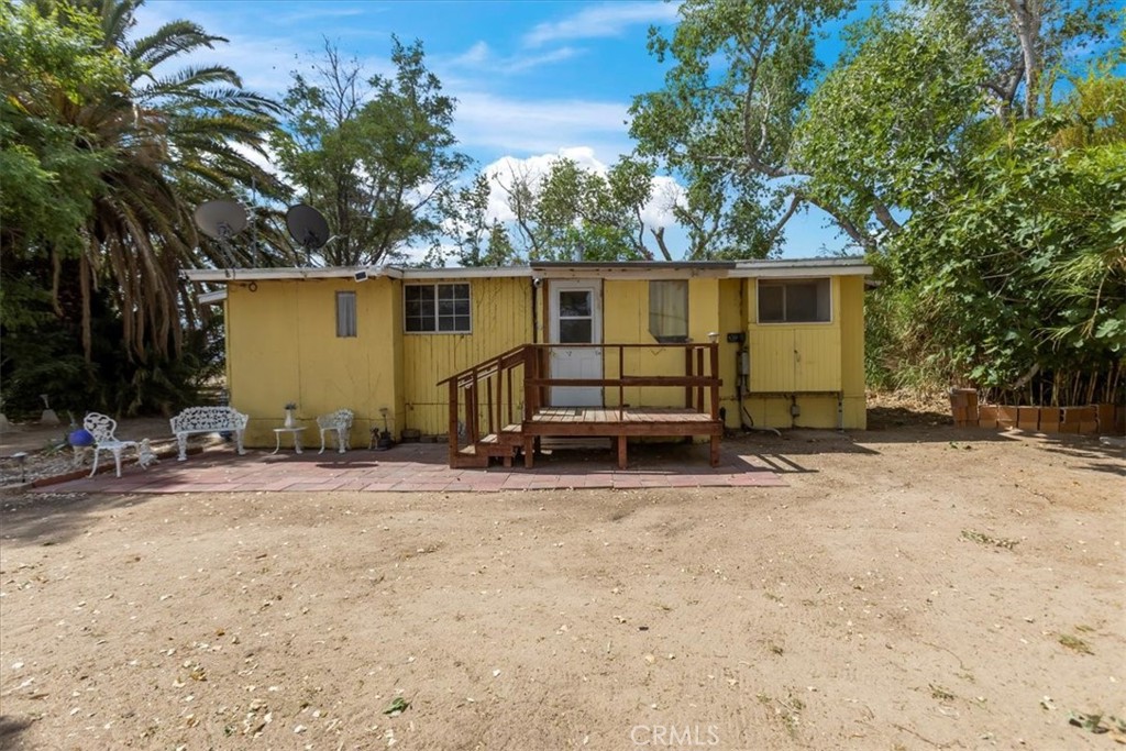45984 Palos Verdes Road Newberry Springs, CA 92365 - Photo 1 of 1 a view of a house with backyard and trees