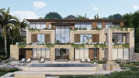 a front view of a house with a garden and plants