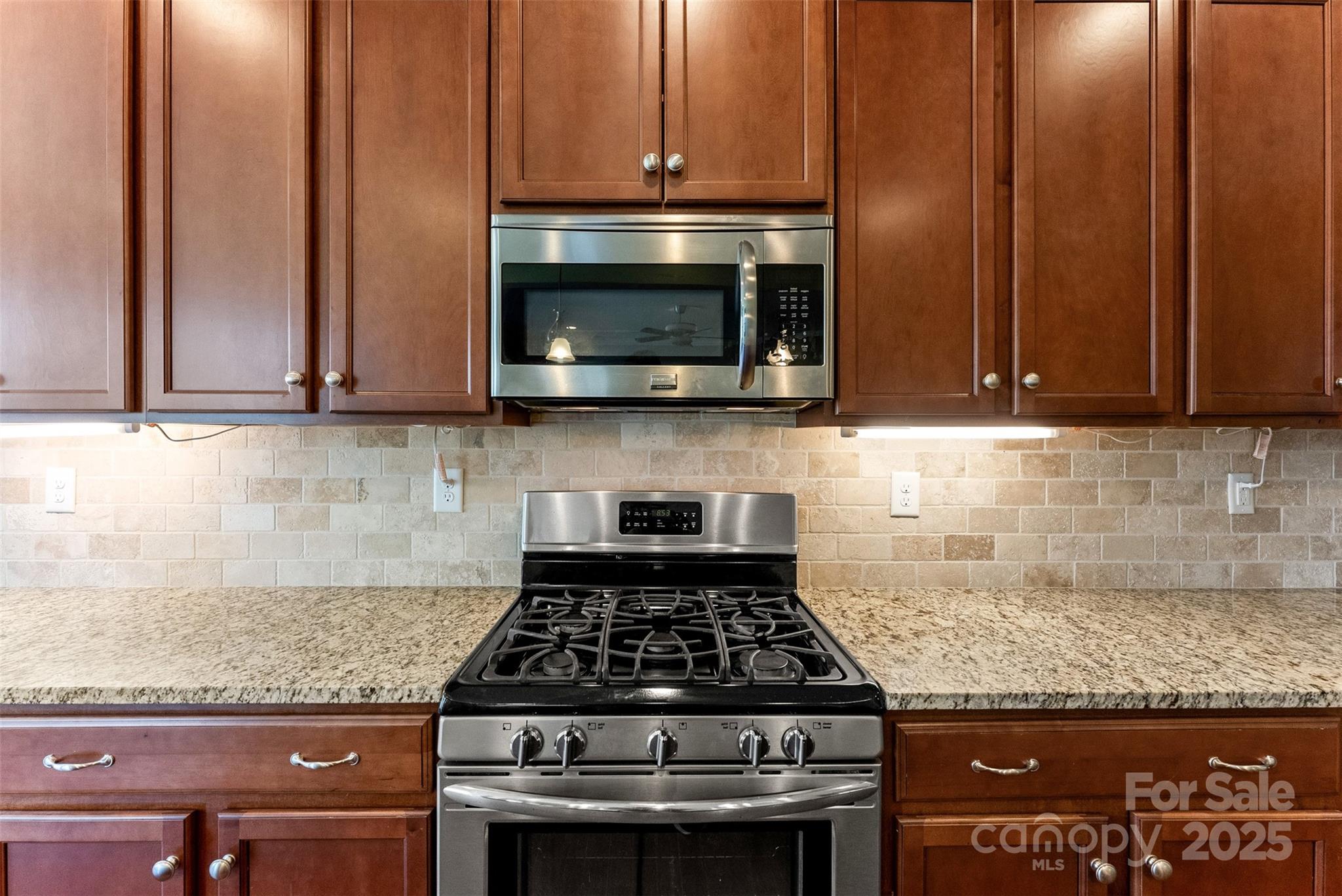 11037 Thornbeck Lane Midland, NC 28107 - Photo 21 of 46 a stove top oven sitting inside of a kitchen