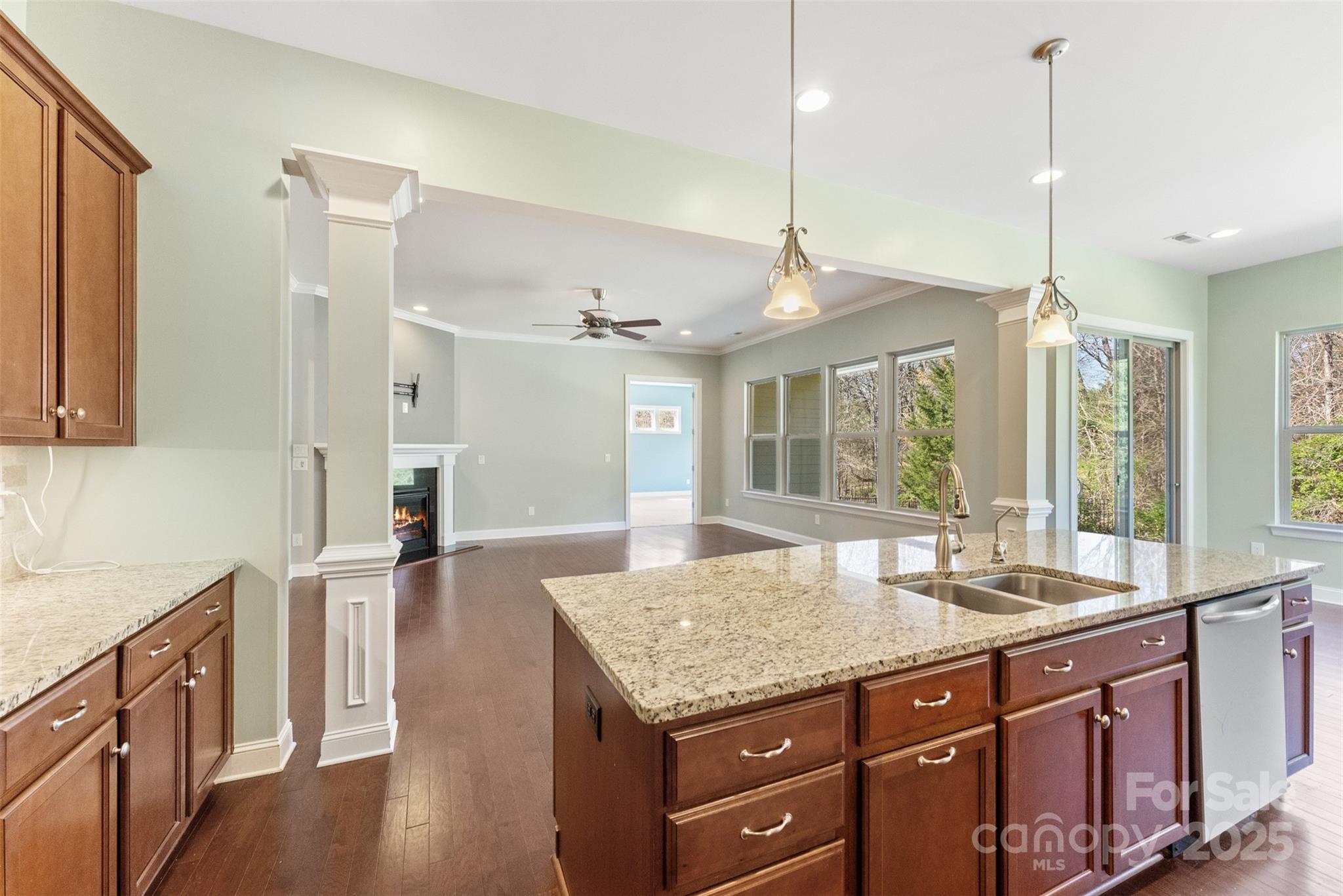 11037 Thornbeck Lane Midland, NC 28107 - Photo 3 of 46 a spacious kitchen with stainless steel appliances granite countertop a sink a oven and a wooden cabinets