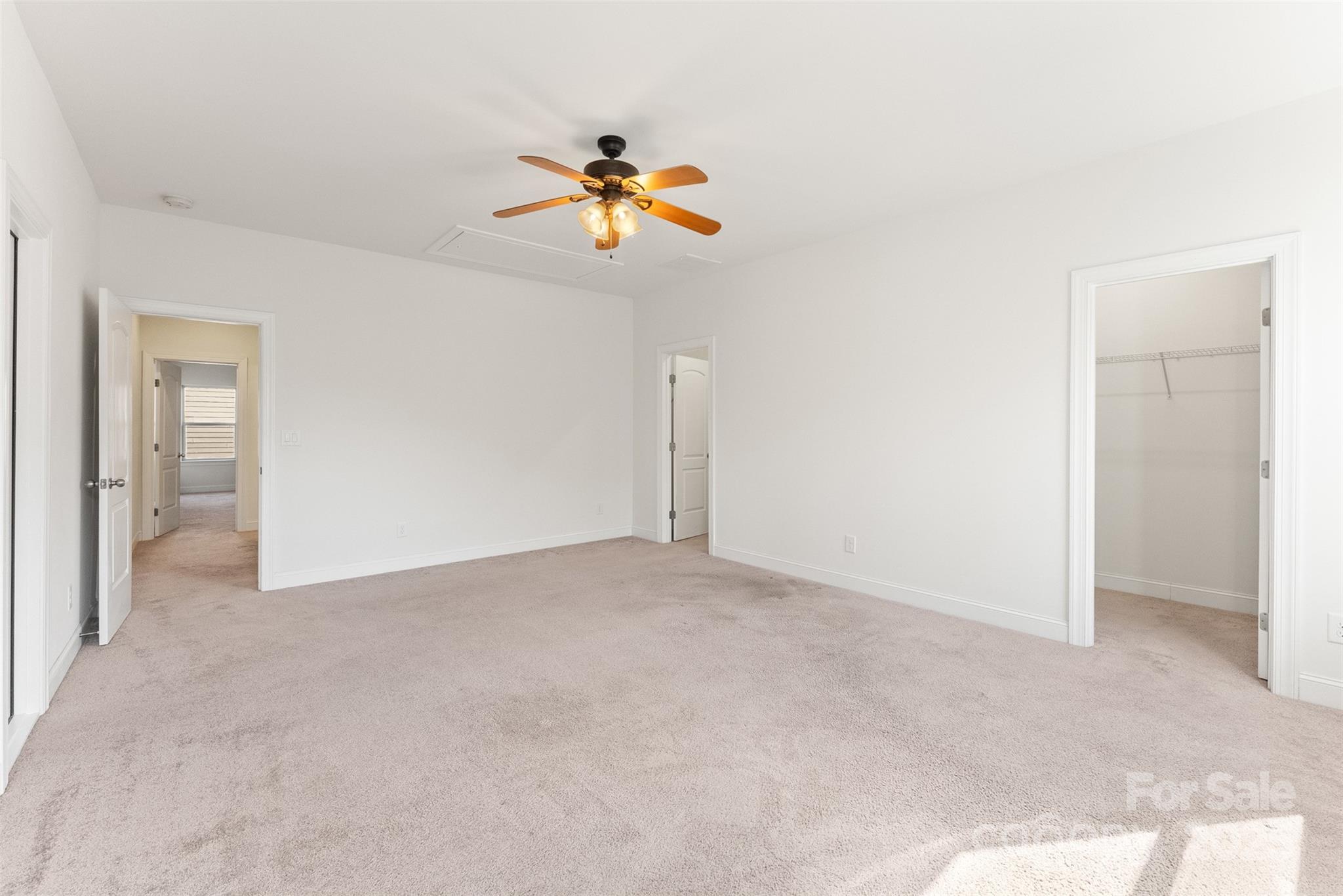 11037 Thornbeck Lane Midland, NC 28107 - Photo 33 of 46 an empty room with windows and chandelier fan