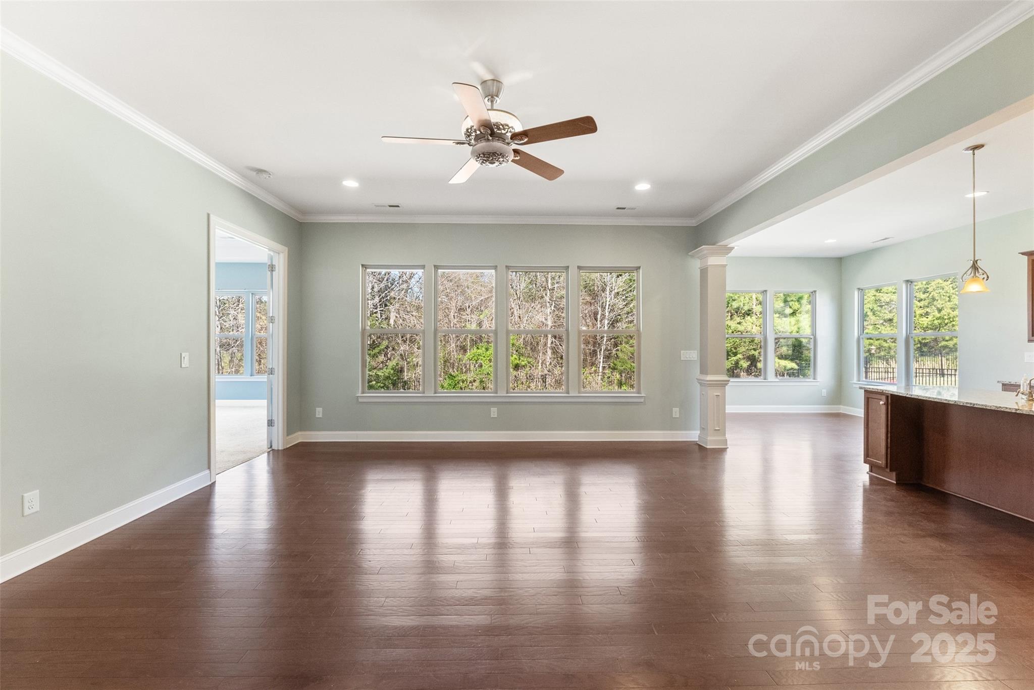 11037 Thornbeck Lane Midland, NC 28107 - Photo 10 of 46 wooden floor in an empty room with a window