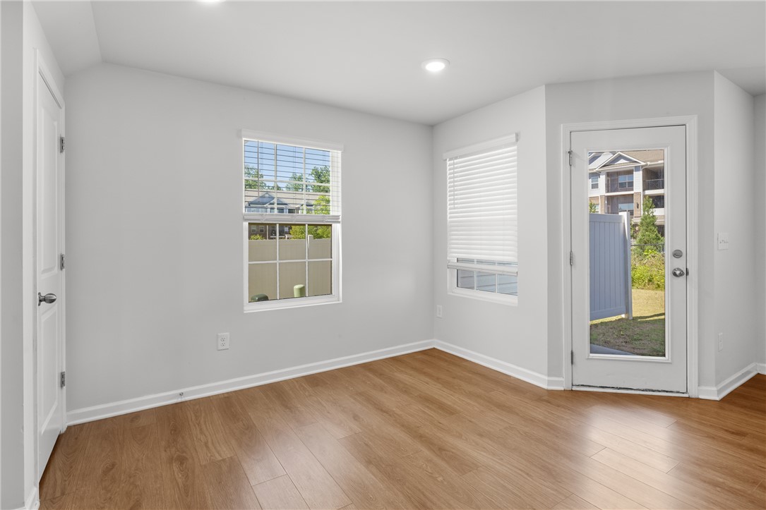 520 Brasstown Court Pendleton, SC 29670 - Photo 8 of 29 Bright and airy living space featuring elegant wood flooring and abundant natural light.