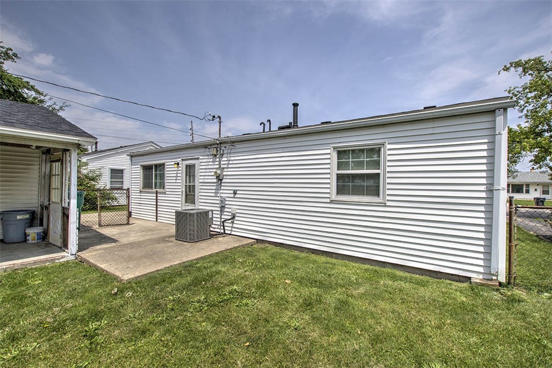 2809 East Cardinal Drive Decatur, IL 62526 - Photo 15 of 20 a front view of a house with a patio
